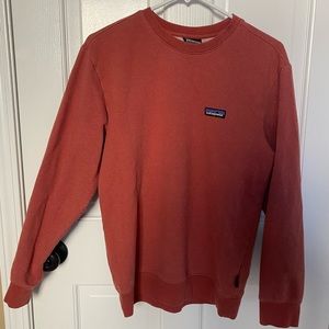 Salmon colored Patagonia pull over.
